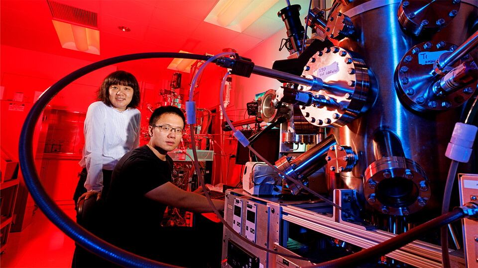 Xia Hong (left), professor of physics, with doctoral advisee Yifei Hao at a lab in Jorgensen Hall.