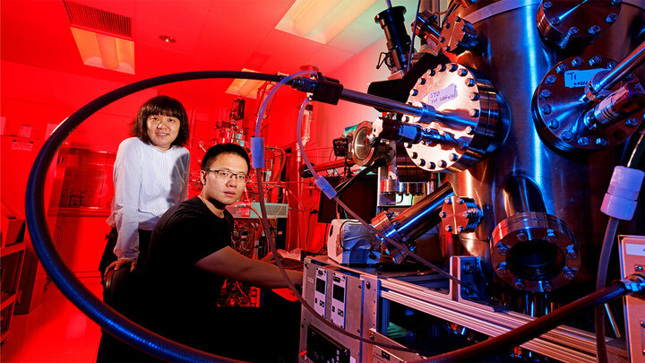 Xia Hong (left), professor of physics, with doctoral advisee Yifei Hao at a lab in Jorgensen Hall. Hong, Hao and their colleagues have discovered a layered combination of nanomaterials that could help scale down the transistor, a vital component of digital technology.