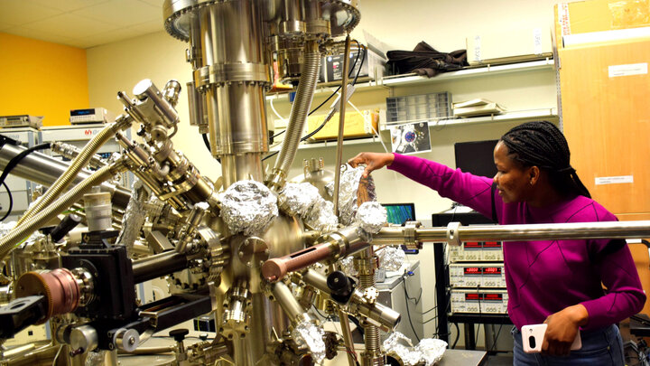 Peace Adegbite works with an ultra high vacuum system equipped with angle-resolved photoemission, scanning tunneling microscopy, X-ray photoemission spectroscopy, low energy electron diffraction and inverse photoemission capabilities.