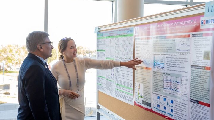 Katherine Johnson gives a poster presentation on the research she completed in partnership with EQUATE.
